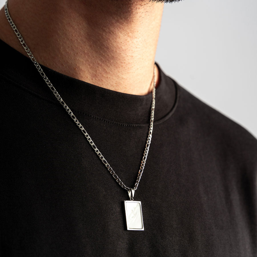 Our Premium Rectangle Pendant paired with our Signature Figaro Chain is the perfect touch of Silver & White.